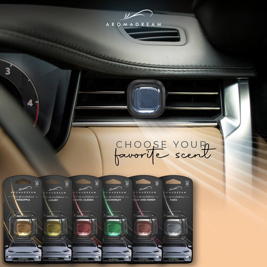 Aromadream Auto Duftclip montiert am Lüftungsgitter – dezenter Lufterfrischer im hochwertigen Fahrzeuginnenraum